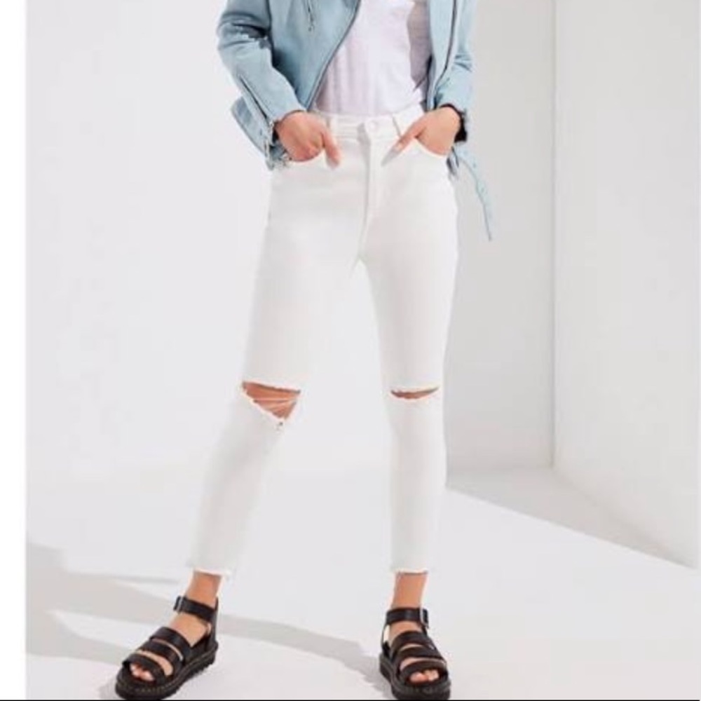 White jeans with ripped knees